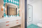 The bunk room ensuite is a playful space for the home`s younger guests.